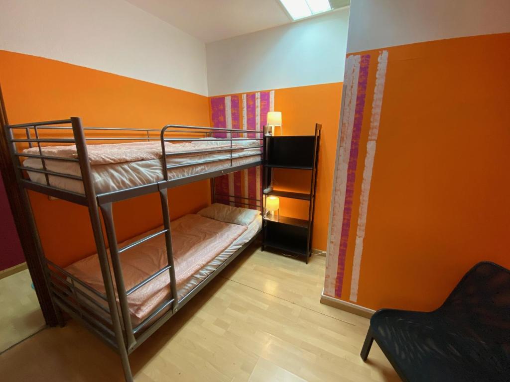 A bed or beds in a room at Bed Madrid Rooms by Bossh! Hotels