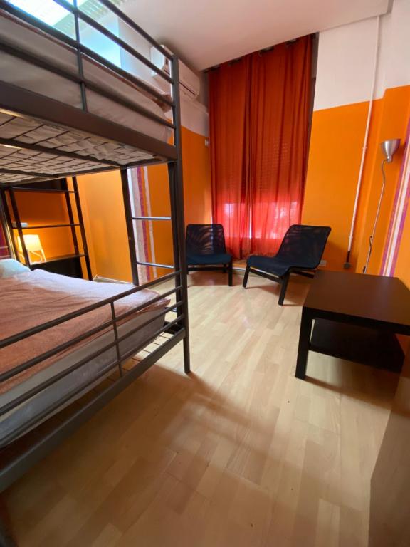 A bed or beds in a room at Bed Madrid Rooms by Bossh! Hotels