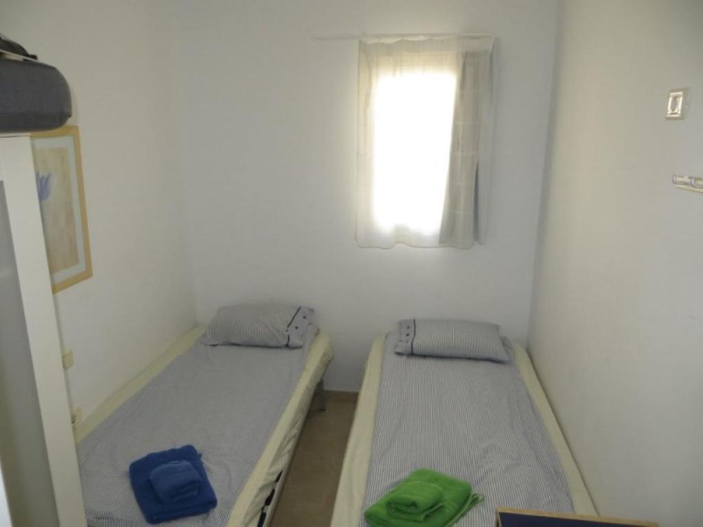 Postel nebo postele na pokoji v ubytování Playa De Mogan Mirador 15