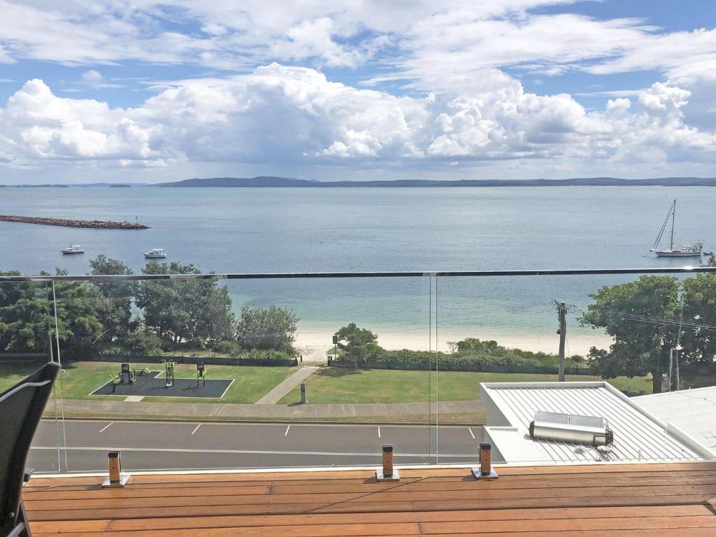 a balcony with a view of the water at Classic View 1, 1 49 Victoria Parade - panoramic water views, aircon and Wifi in Nelson Bay