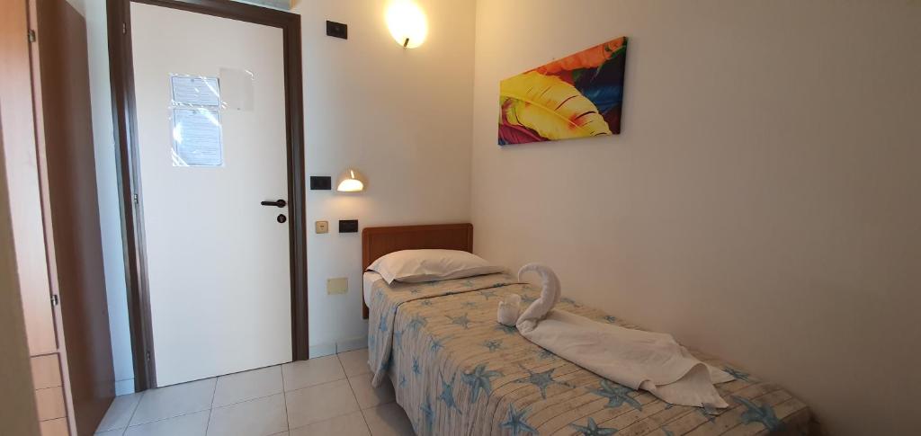 Postel nebo postele na pokoji v ubytování Hotel Vela Azzurra
