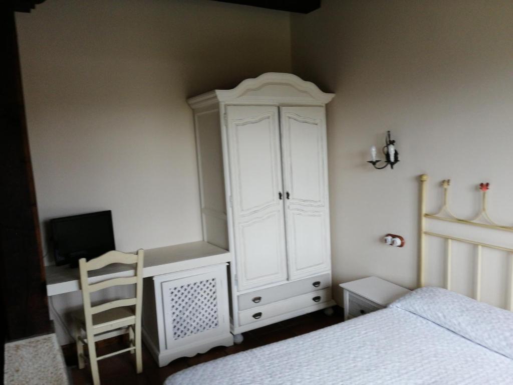 A bed or beds in a room at Posada El Jardin de Angela