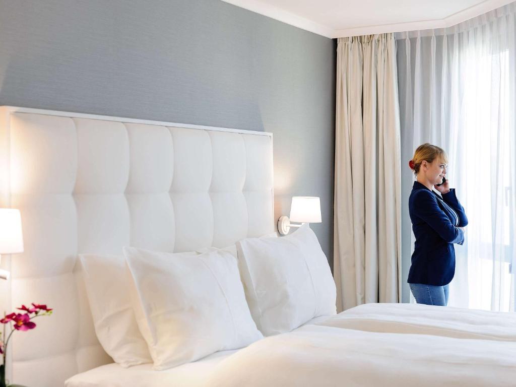 Postel nebo postele na pokoji v ubytování Mercure Hotel Raphael Wien