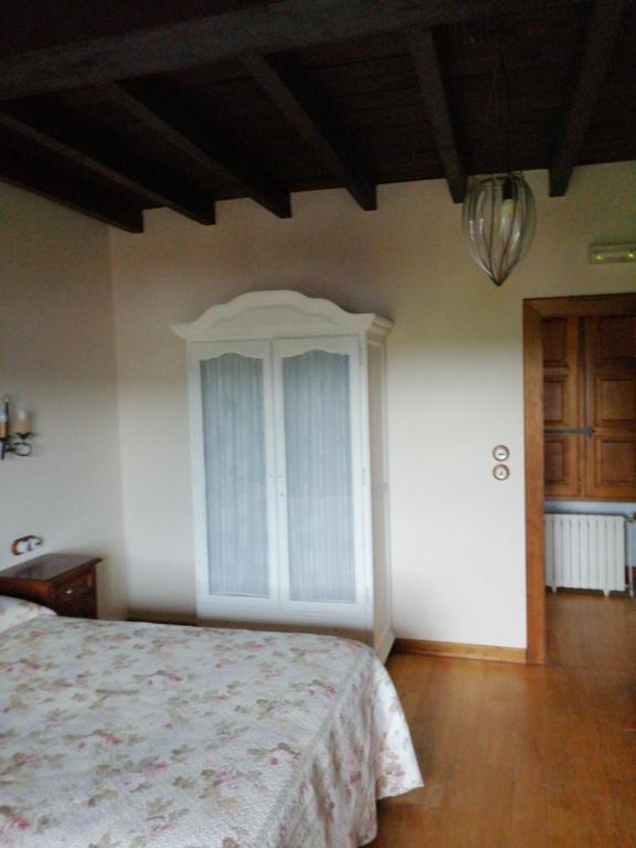 A bed or beds in a room at Posada El Jardin de Angela