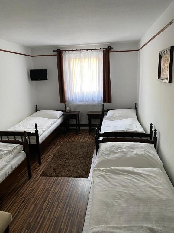 Postel nebo postele na pokoji v ubytování Motel M