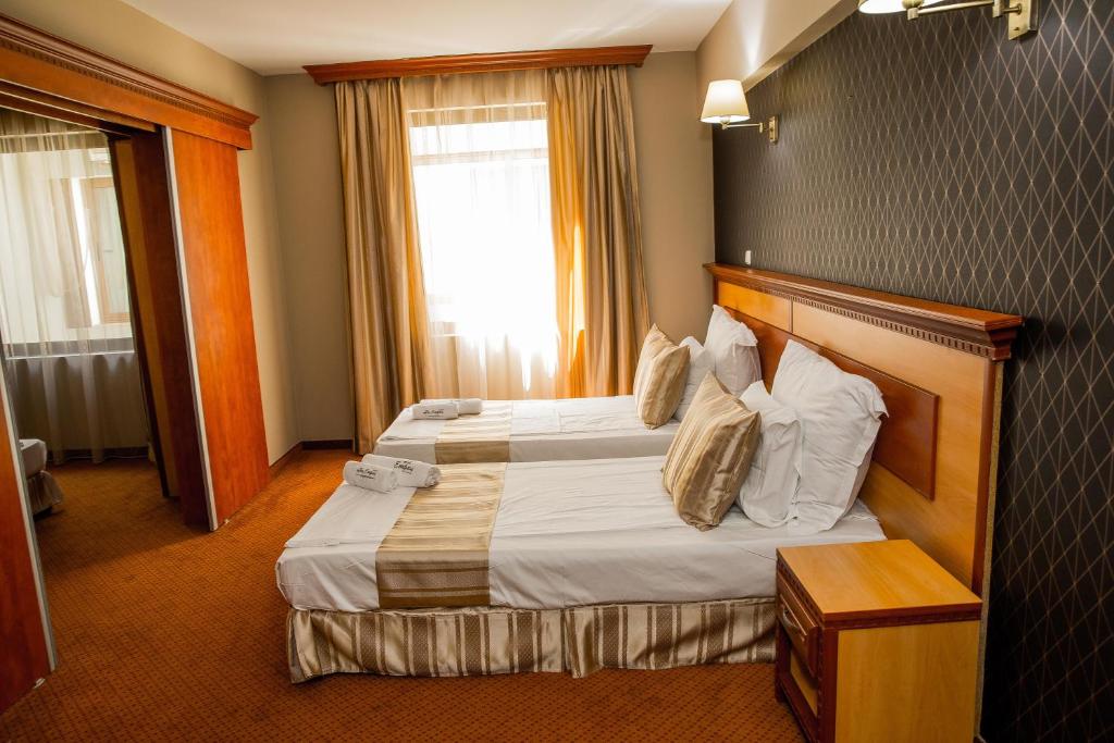 Postel nebo postele na pokoji v ubytování Spa Hotel Ezeretz Blagoevgrad