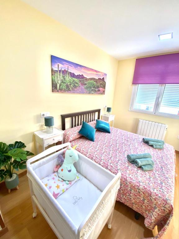 Postel nebo postele na pokoji v ubytování ARENAL HOME, PARKING GRATIS