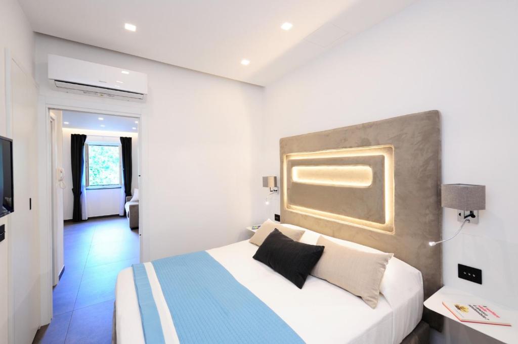 Łóżko lub łóżka w pokoju w obiekcie Amalfi Blu Retreat