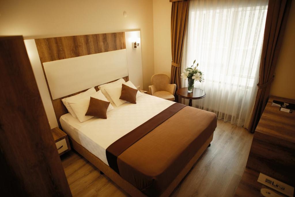 Postel nebo postele na pokoji v ubytování Line Suite Hotel
