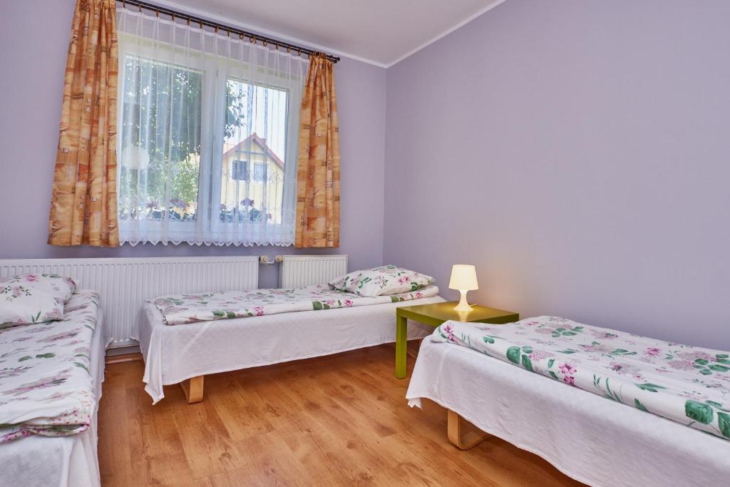 Posteľ alebo postele v izbe v ubytovaní Pokoje Nowakowscy