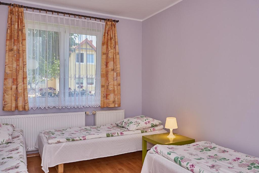 Posteľ alebo postele v izbe v ubytovaní Pokoje Nowakowscy