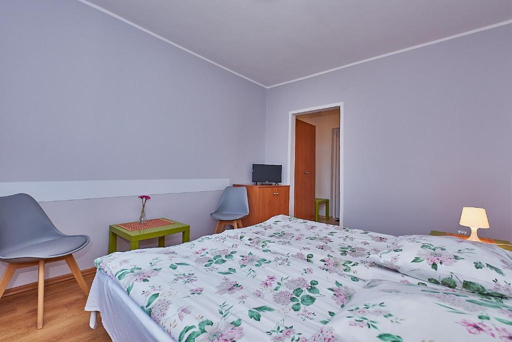 Posteľ alebo postele v izbe v ubytovaní Pokoje Nowakowscy
