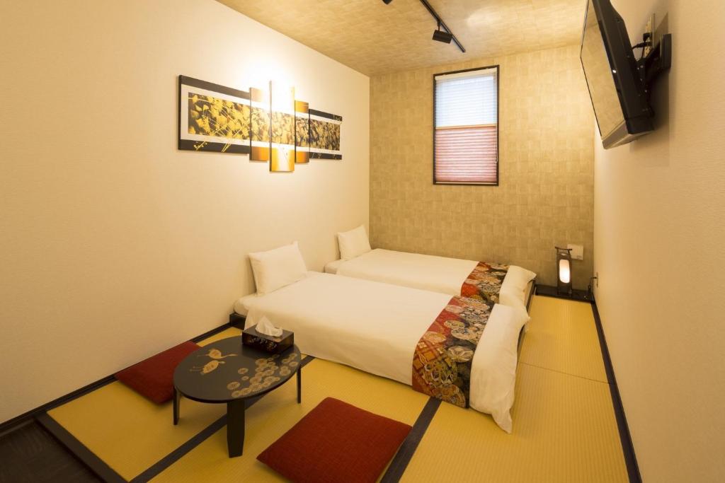 TV a/nebo společenská místnost v ubytování Guest House Wagokoro