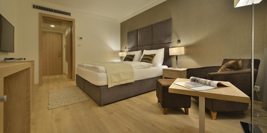 Posteľ alebo postele v izbe v ubytovaní Apollo Hotel Bratislava