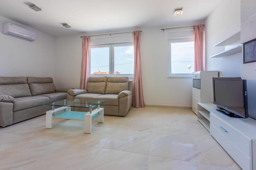 TV a/nebo společenská místnost v ubytování Apartments Cvetkovic