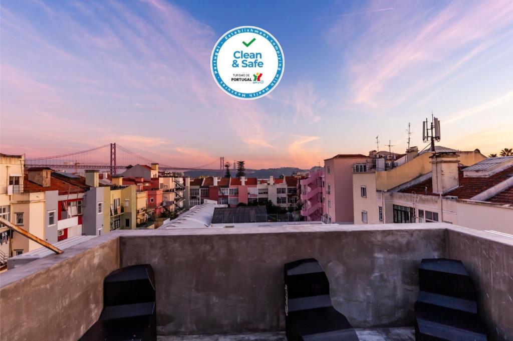 a view of a city from the roof of a building at The Bridge in Lisbon