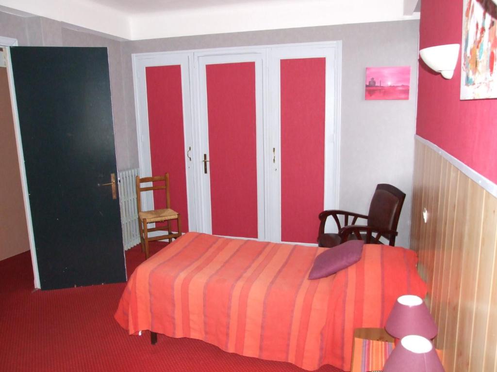 Voodi või voodid majutusasutuse Hôtel du Val d'Aure toas