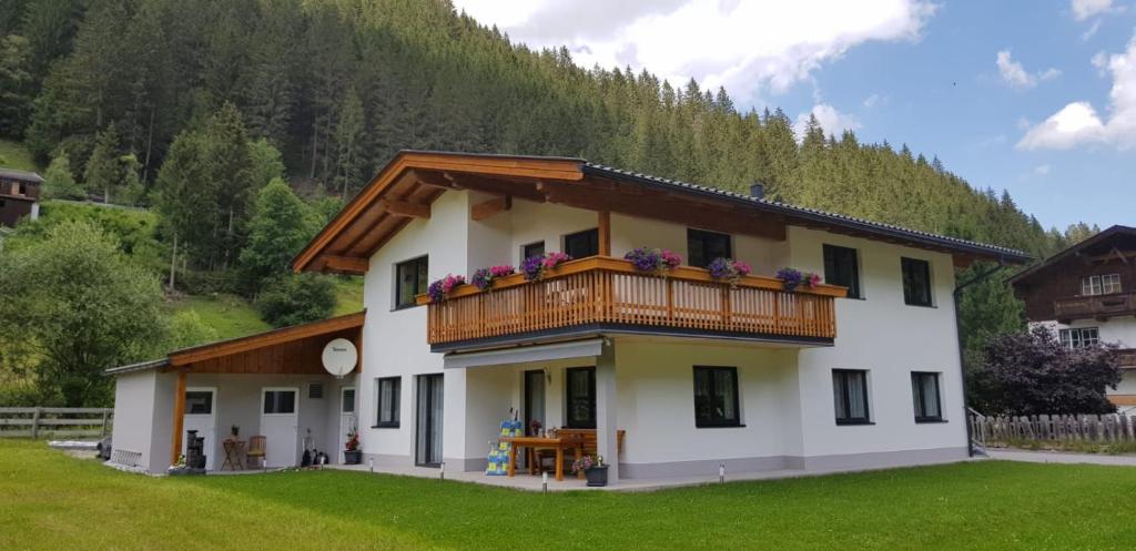 a large white house with a balcony at Haus Blickfang in Neustift im Stubaital