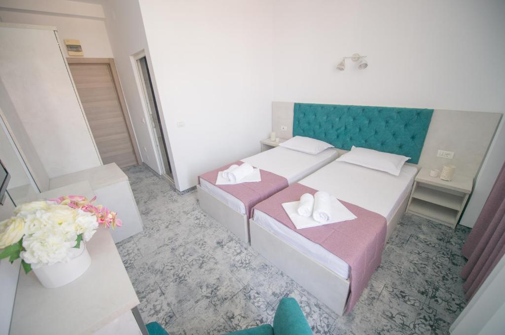 Postel nebo postele na pokoji v ubytování Hotel Olguta