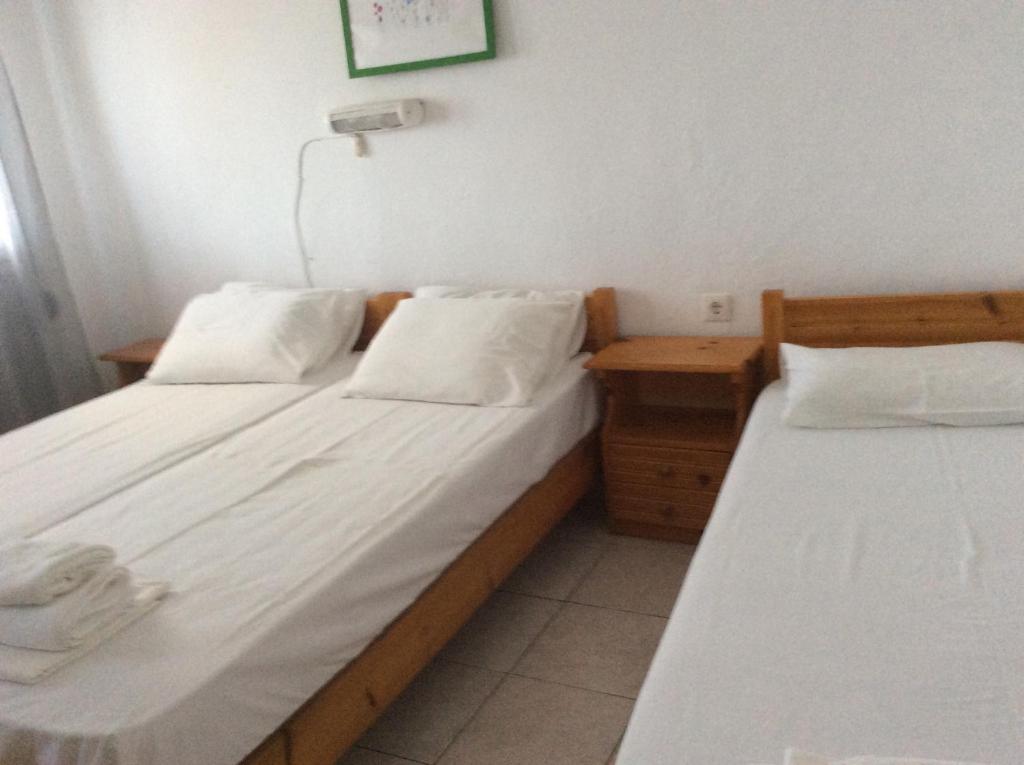 A bed or beds in a room at Despoina Rooms