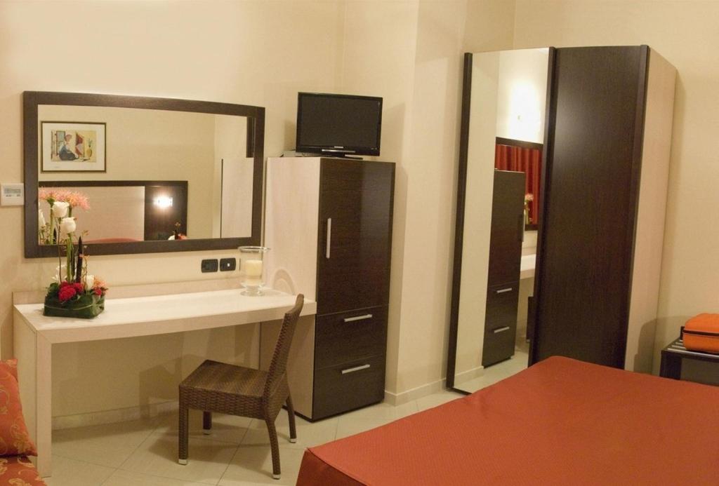 Postel nebo postele na pokoji v ubytování Hotel Risberg