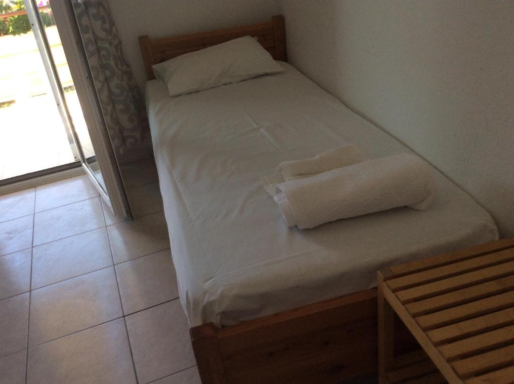 A bed or beds in a room at Despoina Rooms