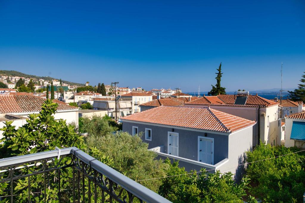 a view of a city from a balcony at Argonaftis Spetses in Spetses