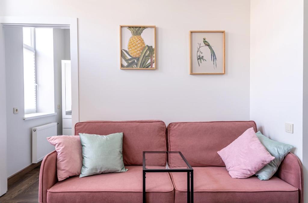 a living room with a couch and a table at River house apartments in Kaunas