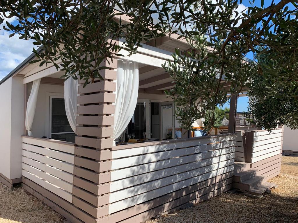 a home with a brick retaining wall with a window at Mobile Home M&M in Drage