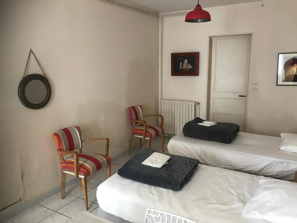Ένα ή περισσότερα κρεβάτια σε δωμάτιο στο residence pasteur - Hermione
