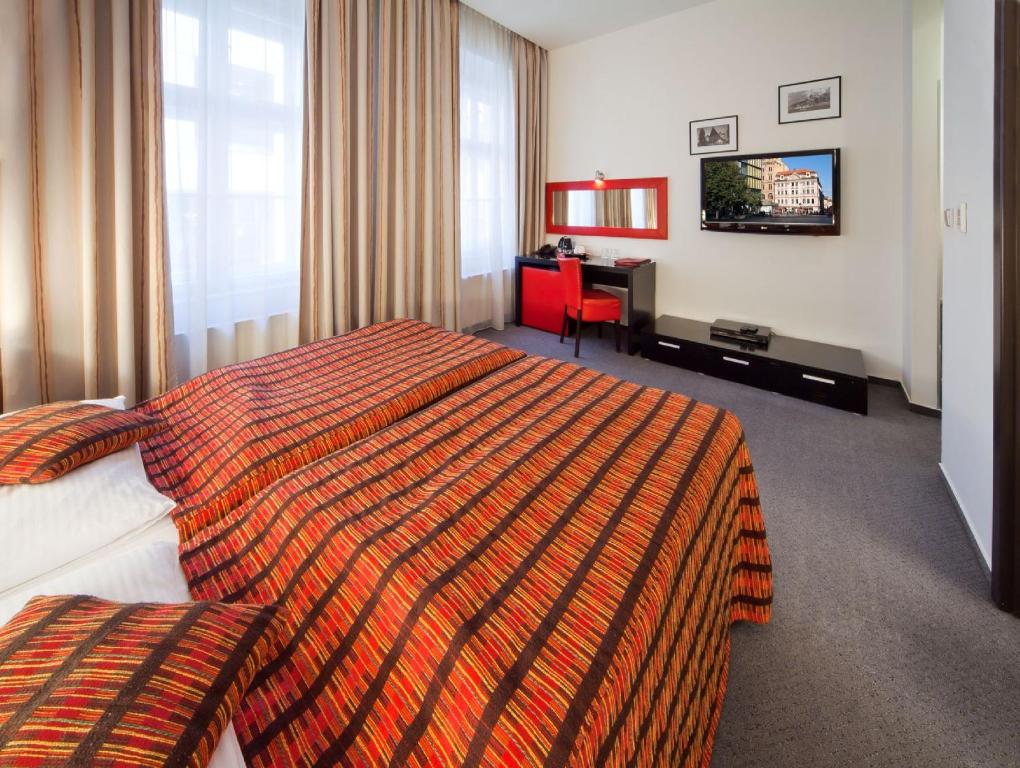 Postel nebo postele na pokoji v ubytování Prague Inn