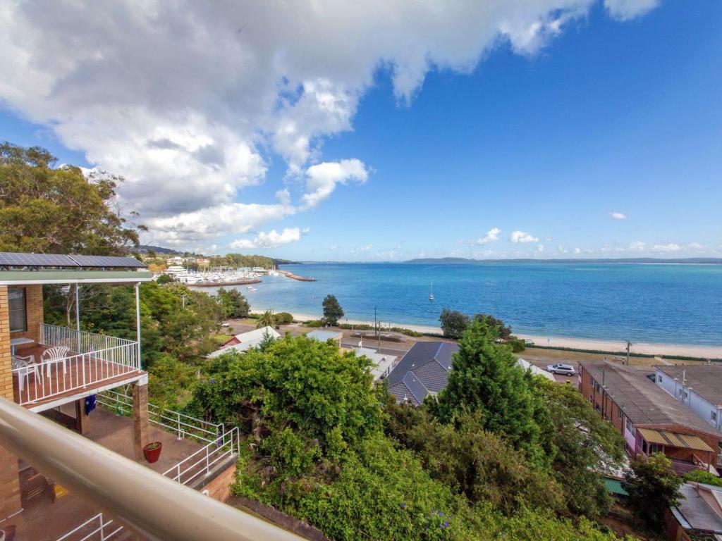 a view of the ocean from the balcony of a house at Quarterdeck 5 panoramic water views and close to town in Nelson Bay
