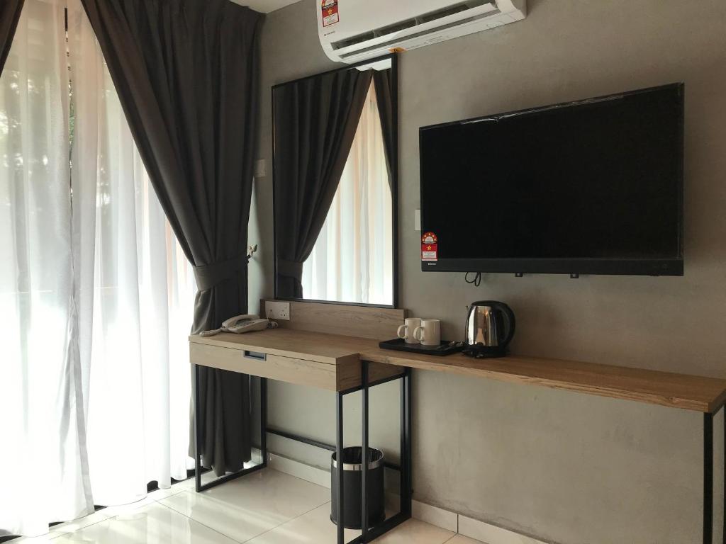 TV a/nebo společenská místnost v ubytování Dandelion Inn