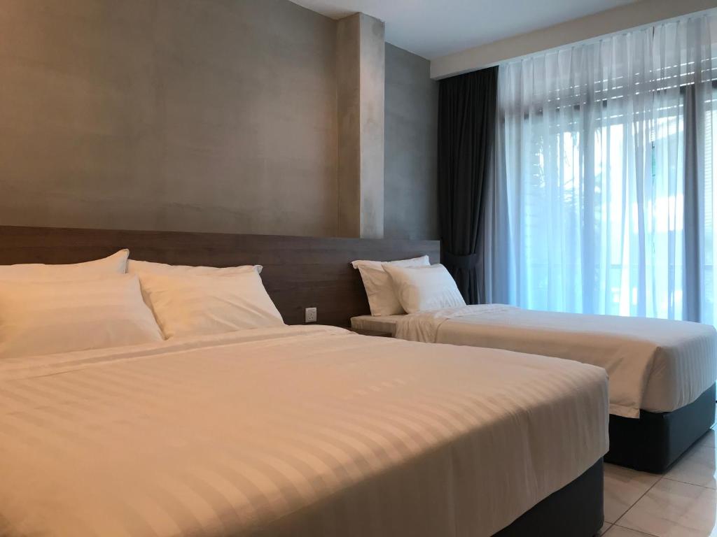 Postel nebo postele na pokoji v ubytování Dandelion Inn
