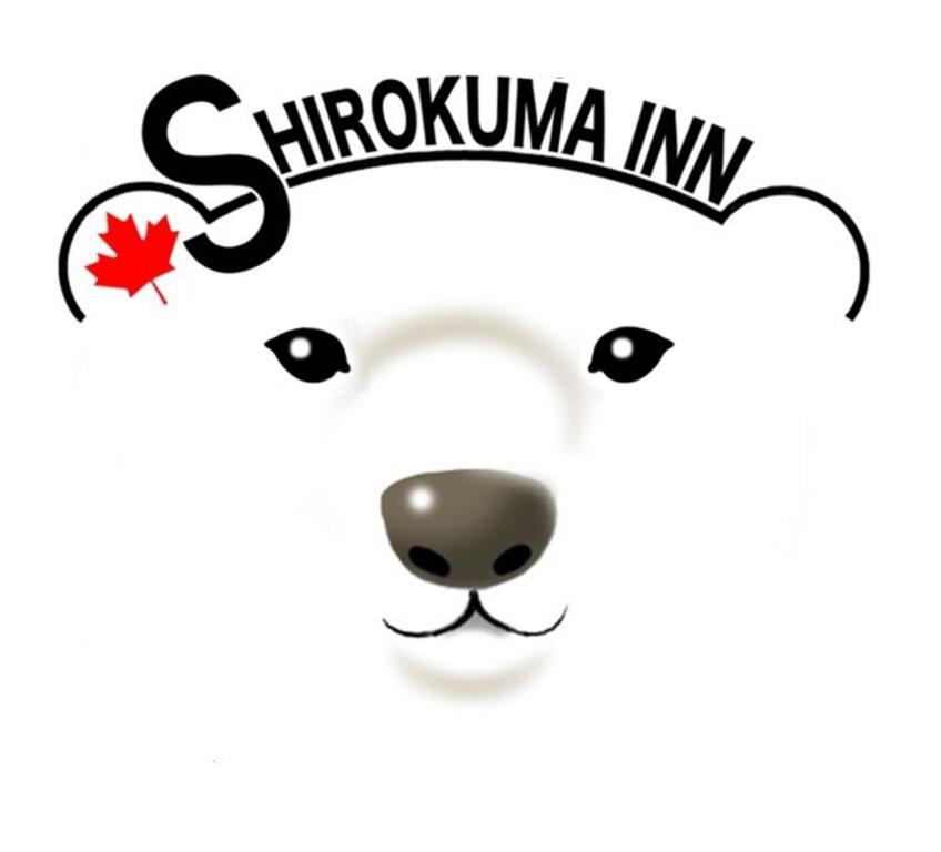 a white polar bear with the words shkuhnia iv at Shirokuma Inn in Toyama