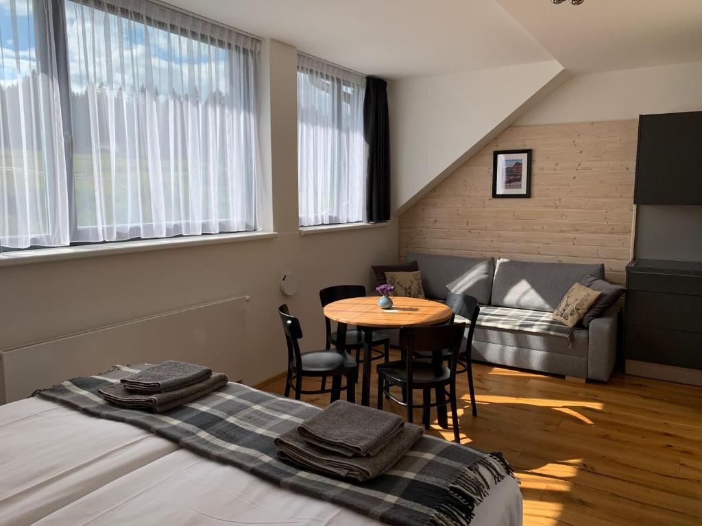 Postel nebo postele na pokoji v ubytování Apartmán Bambi Kvilda