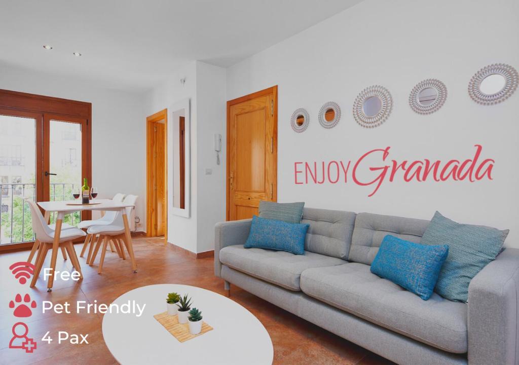 a living room with a couch and a table at EnjoyGranada CARLOS CANO I in Granada
