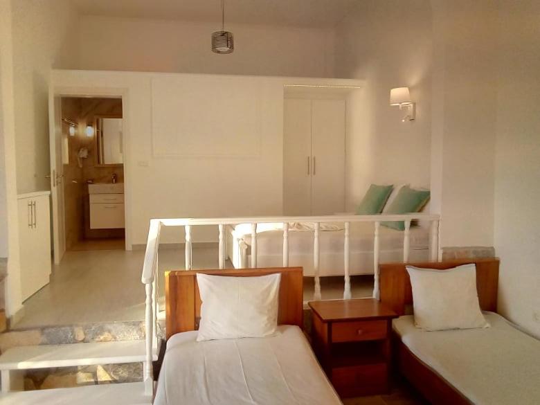 Postel nebo postele na pokoji v ubytování Heaven Beach Sarandë