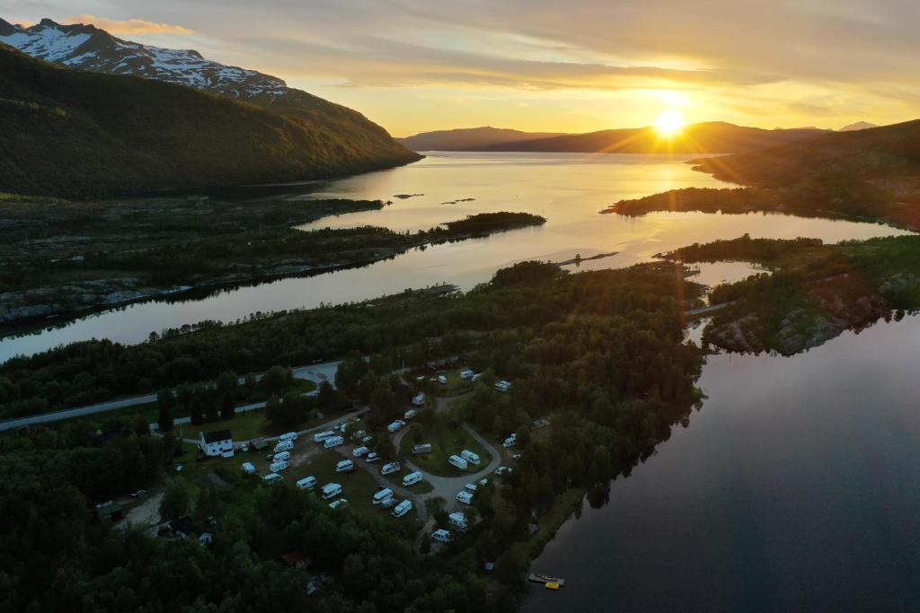 an aerial view of a lake at sunset at Tommerneset Camping in Innhavet