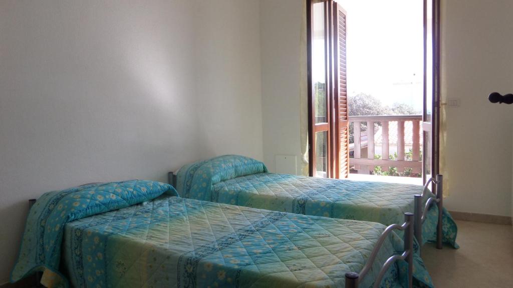 Letto o letti in una camera di B&B La Posada Stintino