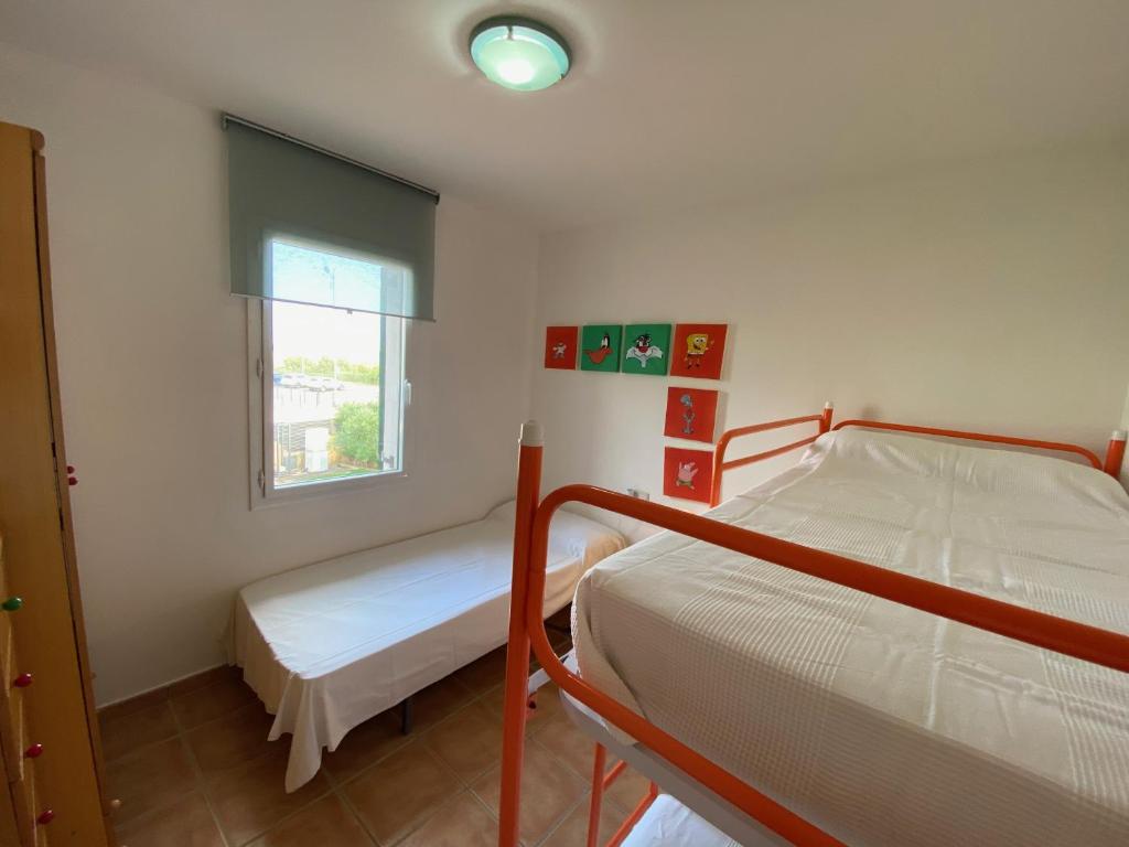 Postel nebo postele na pokoji v ubytování Daró 3D 56 Mas Pinell