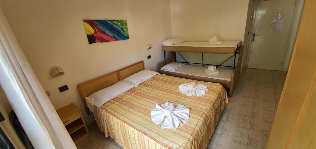Postel nebo postele na pokoji v ubytování Hotel Vela Azzurra