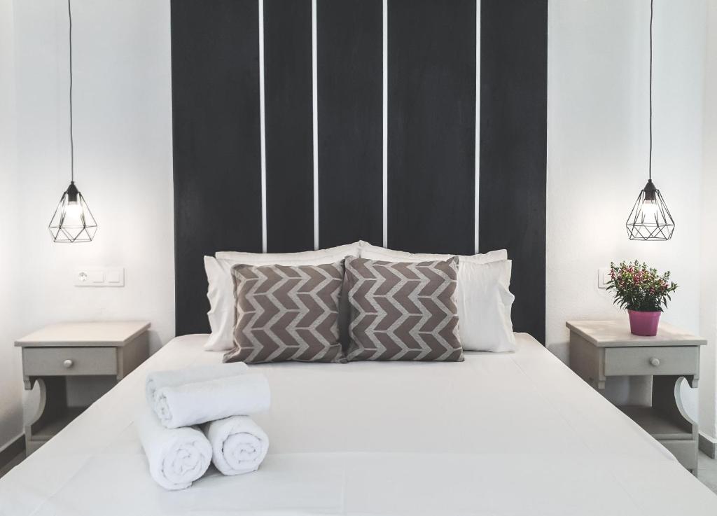 מיטה או מיטות בחדר ב-Imeres Studios & Apartments