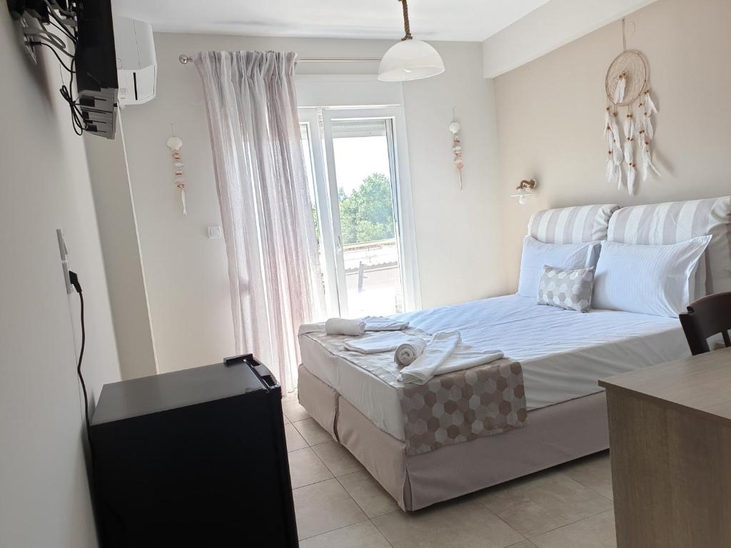 Postel nebo postele na pokoji v ubytování Petrino Studios