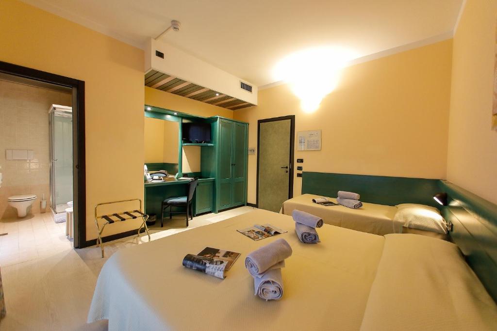 Postel nebo postele na pokoji v ubytování Hotel Eden