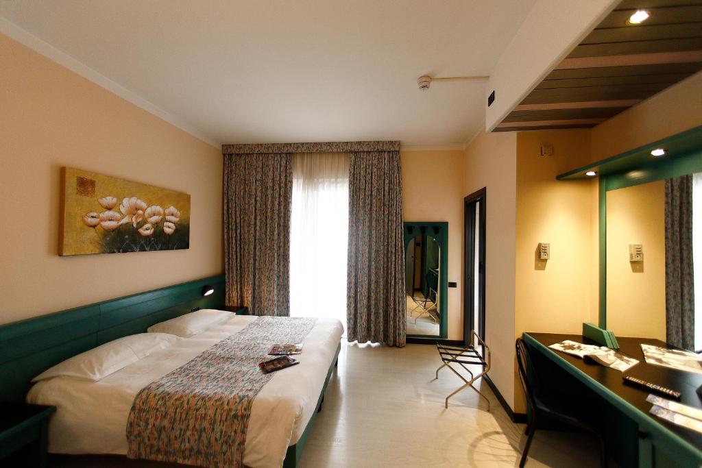 Postel nebo postele na pokoji v ubytování Hotel Eden