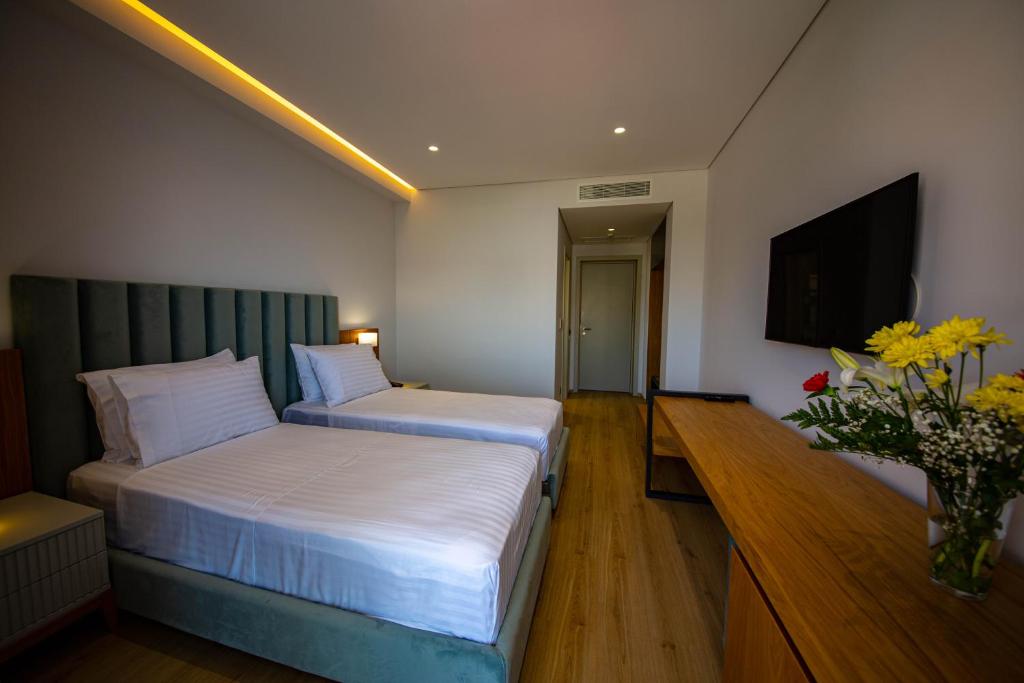 Postel nebo postele na pokoji v ubytování El Primero Hotel