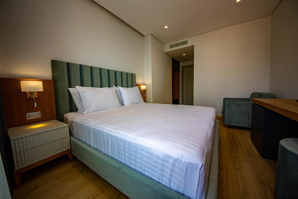 Postel nebo postele na pokoji v ubytování El Primero Hotel