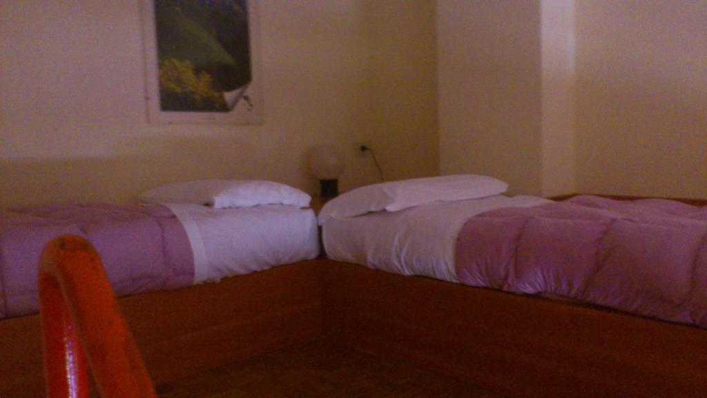 Postel nebo postele na pokoji v ubytování Hotel La Fonte