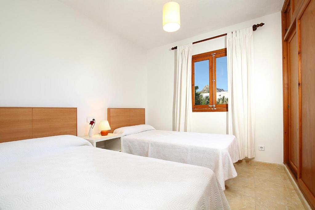 A bed or beds in a room at Villa Animeta